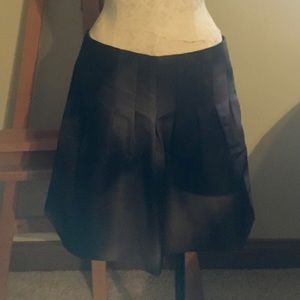 Calvin Klein black and silver mini skirt.